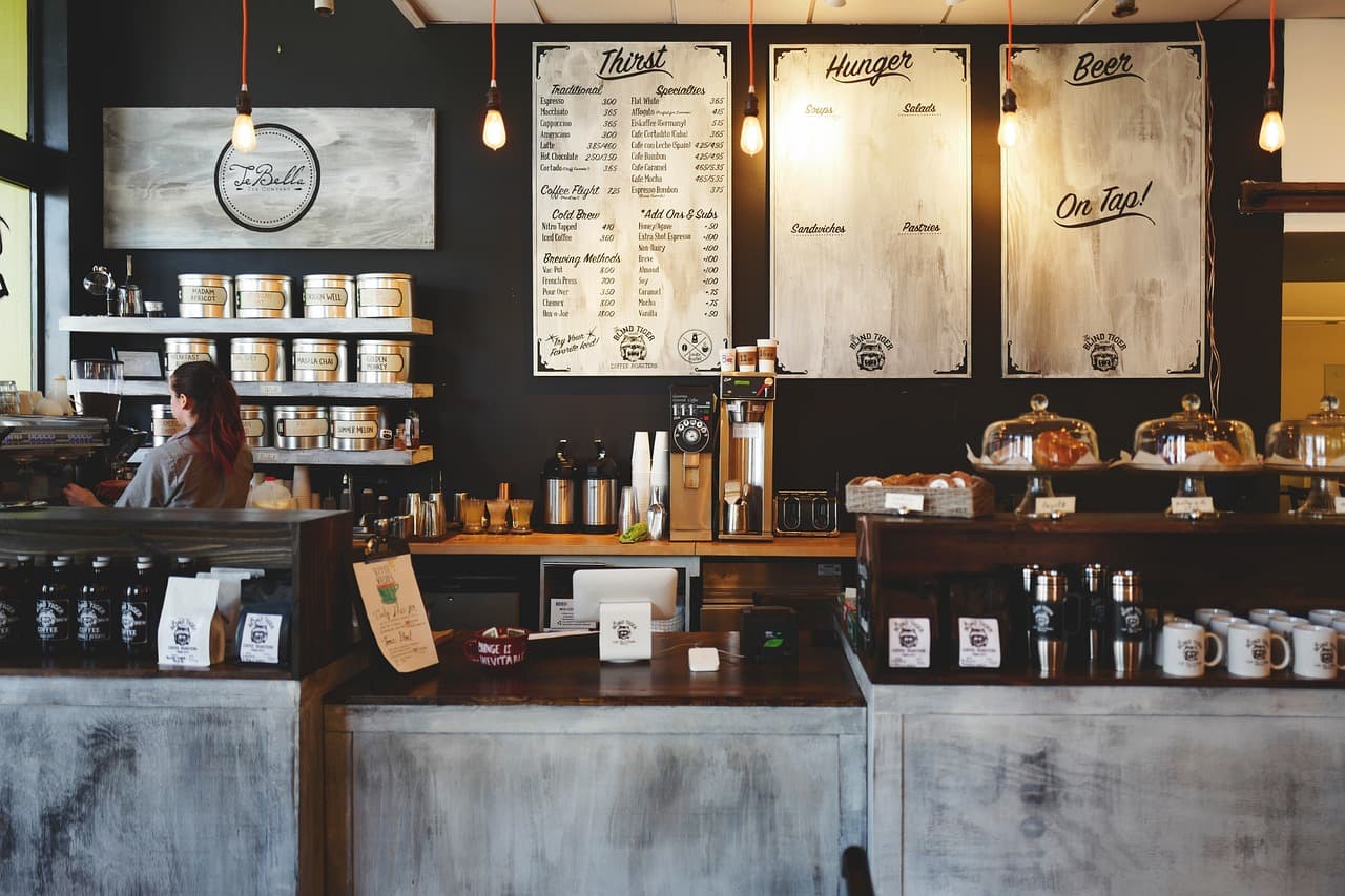A modern cafe counter with warm lighting